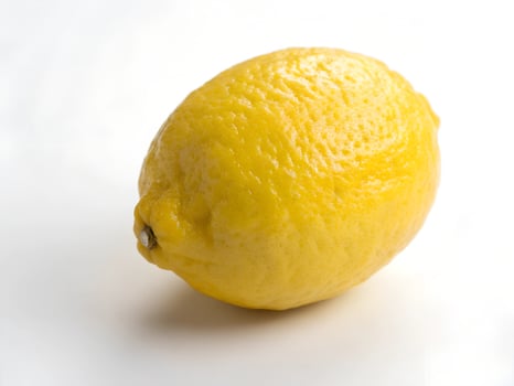 a fresh lemon is shown on a white background photo