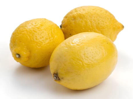 three lemons on a white background photo