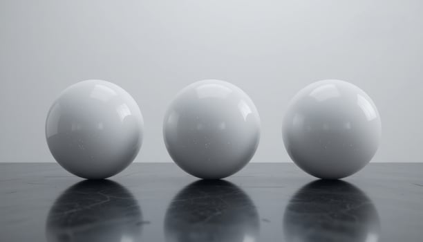 Three Glossy White Spheres on a Dark Reflective Surface Minimalist Still Life Photography photo