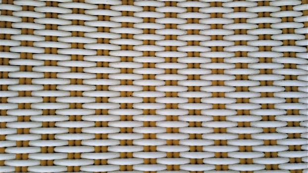 Plastic chairs are made from woven plastic, usually placed in the yard outside photo