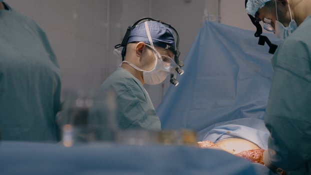 Team doctor surgeon medic nurse physician process surgical bariatric operation in operating room emergency help patient medical surgery incision stomach cancer medicine health care in hospital clinic photo