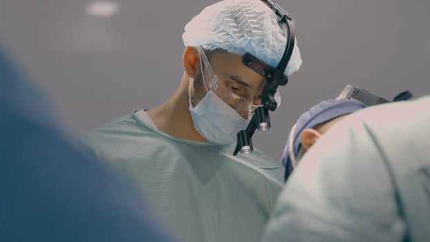 Team of professional surgeons perform heart transplant operation in medical operating room team doctors paramedics in hospital clinic surgical laparoscopy procedure cancer disease surgery health care photo