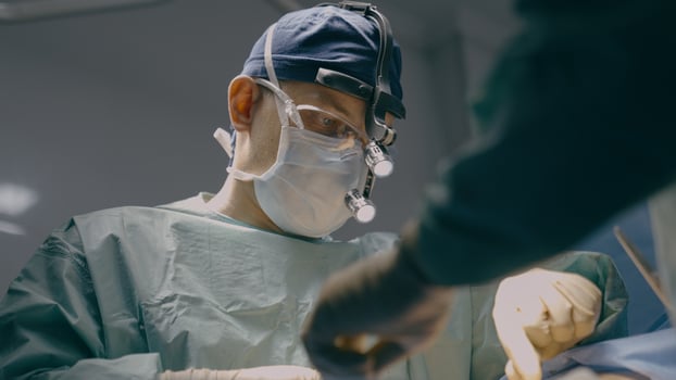 Two doctors in uniform mask physician medic man surgeon medical nurse perform surgical operation emergency help in hospital clinic plastic surgery transplantation operate patient health medicine aid photo