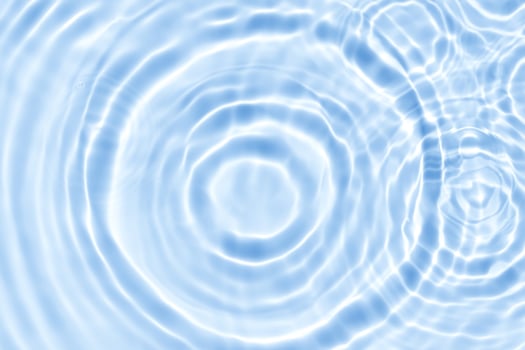 Water background,Summer blue water ripple surface texture wave in bathroom,Top view swimming pool with natural sunlight effect on abstract circle pattern for spa photo