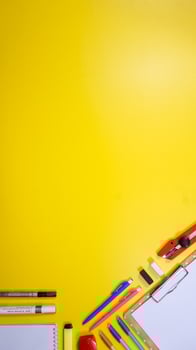 School Supplies Isolated on Yellow Background photo