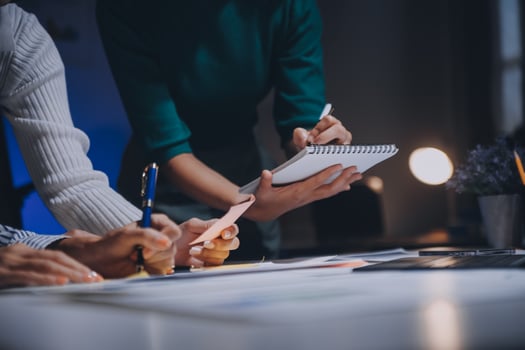 Business people working on a project at a desk photo