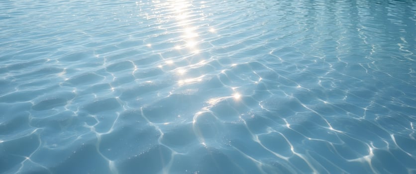 Sunlight Sparkling on a Calm Blue Water Ripple Surface photo