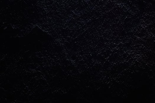 Background with a black stone texture. With space to copy. A place to add text or design photo