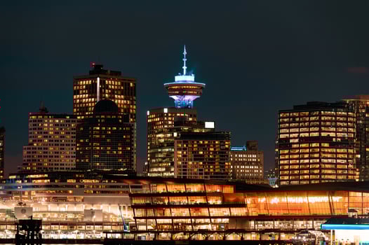 Cityscape of Modern building illuminated of central market on coastline at Stanley park photo