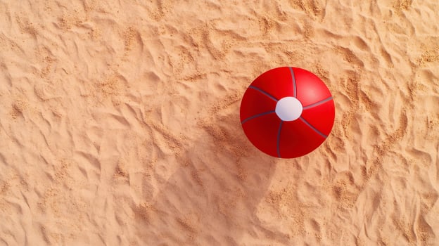 A red and white ball on the sand photo