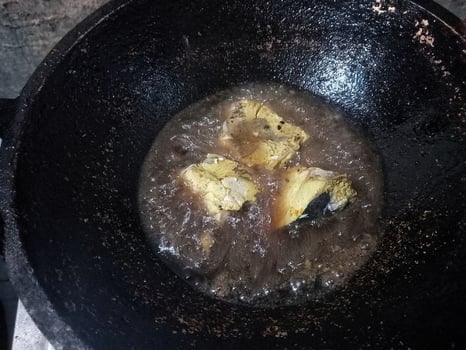 fish fried in hot oil, fried fish dishes photo