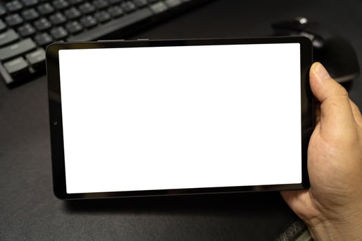 Digital tablet with isolated screen in male hands. photo