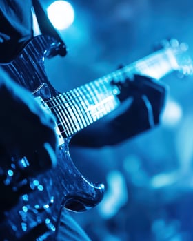 Electrifying Guitar Performance Under Blue Stage Lights A Captivating Close-Up photo