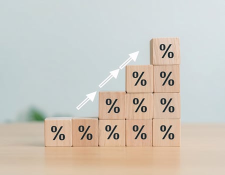 Percentage Symbol on Wooden Cubes with Rising Arrows, Financial Growth photo