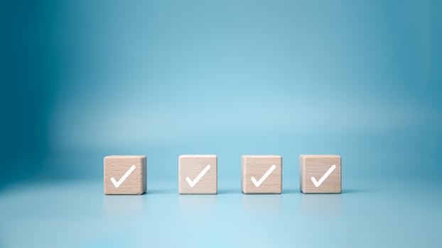 Checklist, Task list, Process success, Solving solution, Mission complete, Survey and assessment and voting, Quality Control, Goal achievement business, White correct check mark on wooden blocks. photo