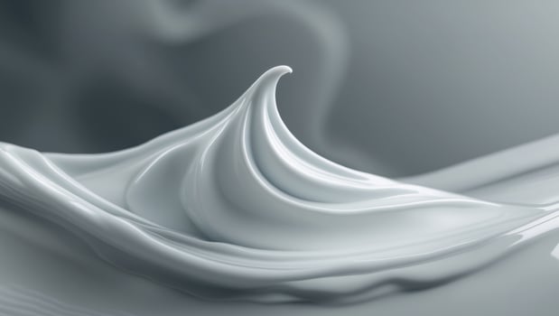 White cosmetic cream spreading on grey background photo