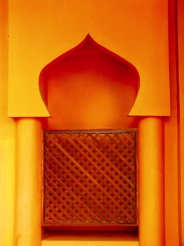 Islamic background architecture. Small archway with a wooden lattice on the inside. photo