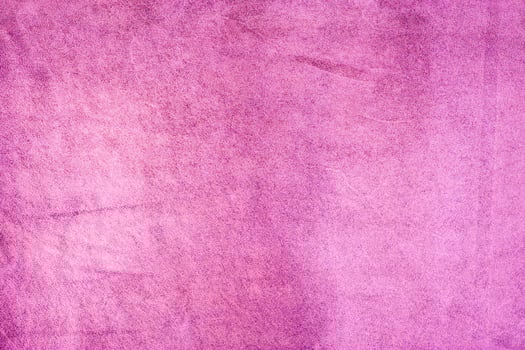 Raspberry pink suede background. Light pink purple suede leather macro photo. photo