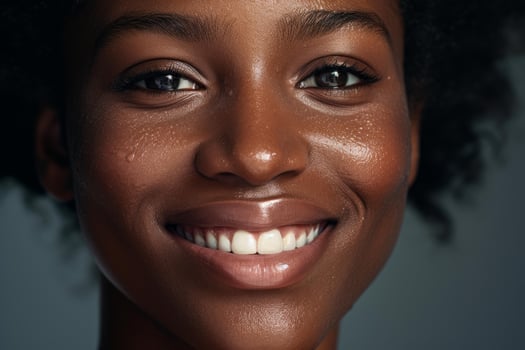 Beautiful smiling black woman with perfect white teeth showing happiness and confidence photo