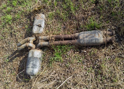 Eco Problem Concept - Discarded Car Exhaust photo