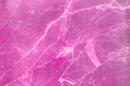 Pink texture of stone marble. Surface of marble stone with striped streaks. photo
