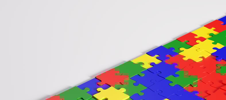 Colorful puzzle pieces forming a diagonal line. photo