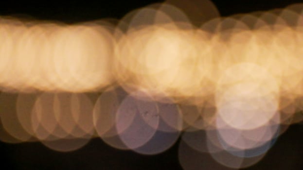 Mesmerizing bokeh effect created by out of focus lights glowing beautifully against a dark background. This dreamy, atmospheric aesthetic is often used. photo