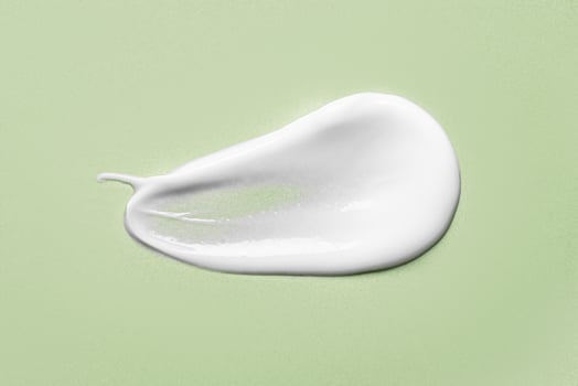 Moisturizer cream gel sample on green photo