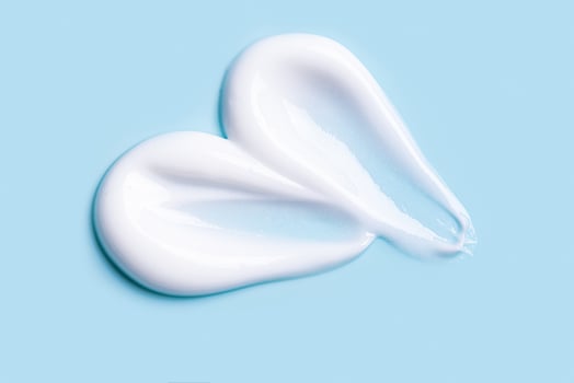 Cosmetic cream gel sample on blue photo