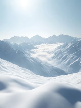 Snow-covered mountains under a bright blue sky photo