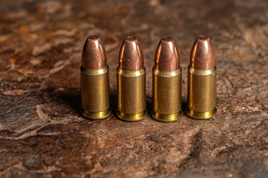 Four bullets on a textured surface photo