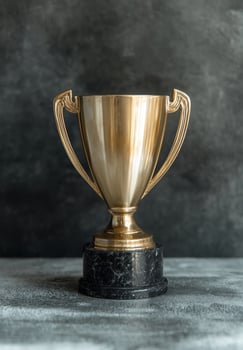 Golden trophy on a dark background. photo