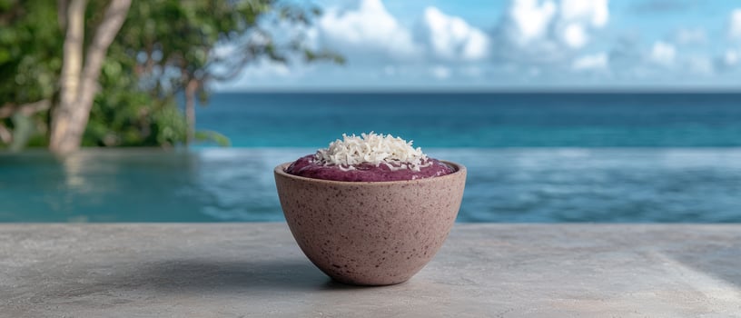 Acai bowl with coconut flakes by the pool photo