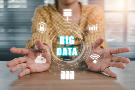 Big data concept, Person hand holding big data icon on vr screen on office desk. photo