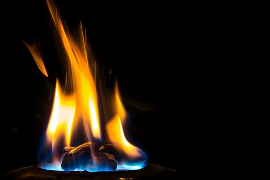 Vibrant flames against dark background with intense heat and flickering light photo
