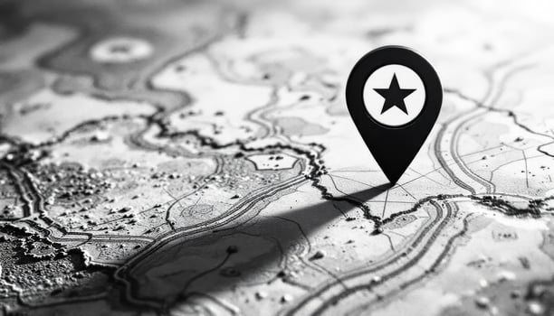 A map pin is pointing to a star on a map photo