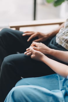 A nurse holding the hand of a patient photo