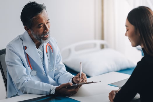 A doctor talking to a patient photo
