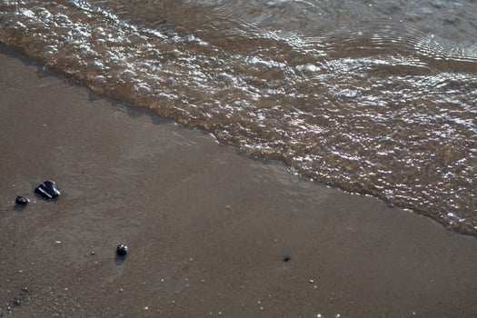 Sea waves to the beach photo