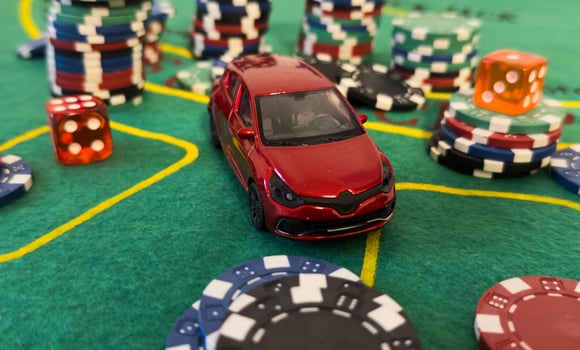 pile of casino chips and toy car, photo