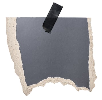 Torn piece of black cardboard attached to a piece of electrical tape, isolated background photo