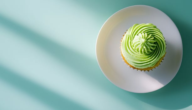 Matcha cream cupcake sweet baked snack dessert for kids on white plate photo