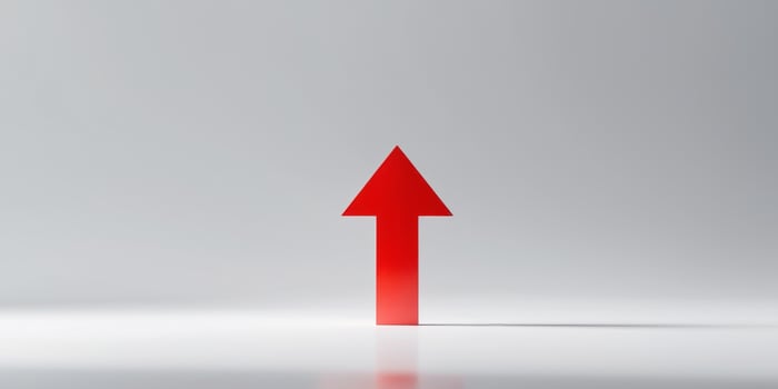 Red upward arrow symbolizing growth and progress photo