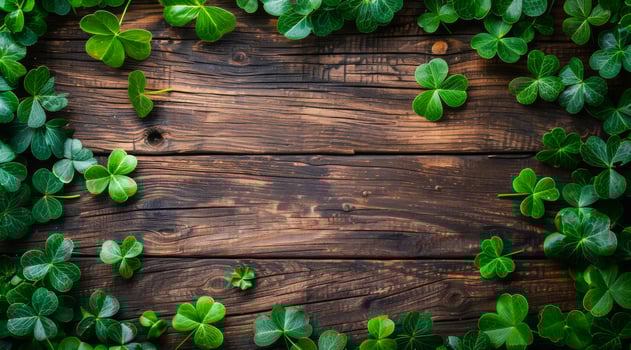A wooden frame with green leaves surrounding it. The frame is made of wood and the leaves are green. Patrick's Day decor for Irish holiday. photo