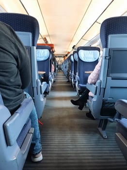 A train car with people sitting in it photo