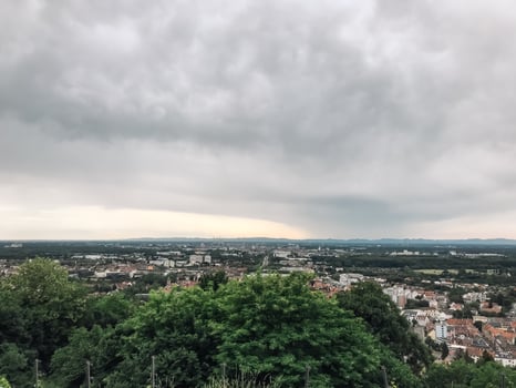 A city skyline is visible in the distance, with a cloudy sky overhead photo