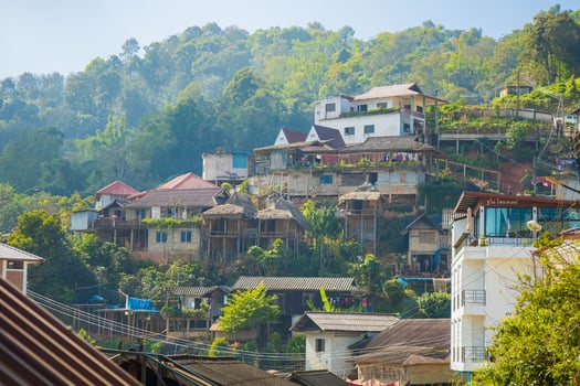 Hillside village in countryside, Chiang Rai with blue sky. photo