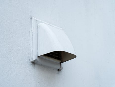 White wall vent with protective cover photo