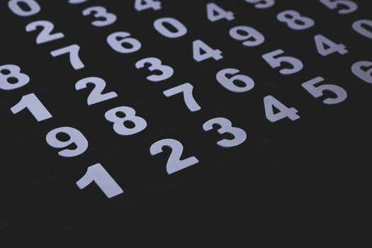 Close up of numbers on a blackboard. Toned image. photo