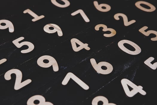 different numbers figure on black texture photo